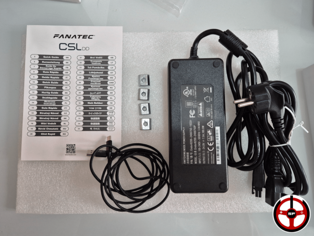 Le contenu du carton du fanatec csl dd : Notice de démarrage rapide, 4 écrous en T, blioc d'alimentation et son cordon, câble USB Type C vers Type A